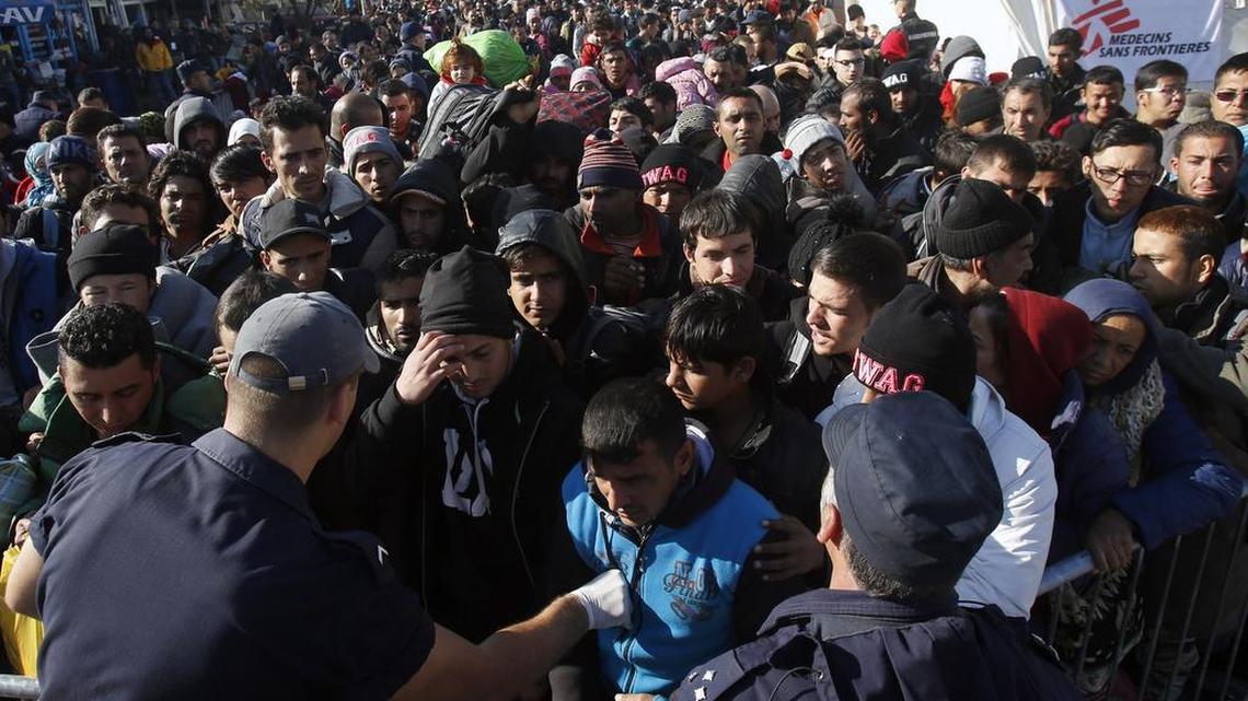 Refugees crowded a refugee center in Presevo, Serbia, on Monday. The United States has agreed to take 10,000 in the next year.