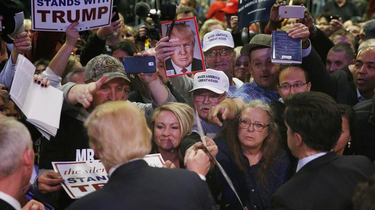 Republican presidential candidate Donald Trump greets supporters Monday at a rally in Las Vegas.