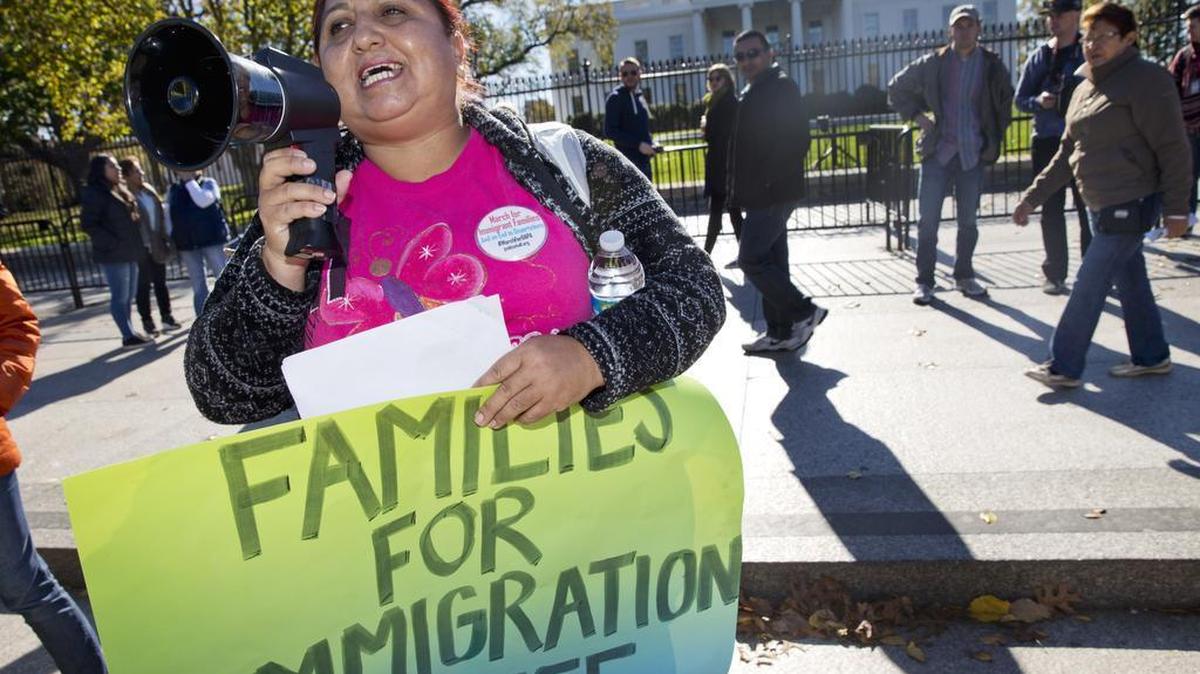 FILE - In this Nov. 20, 2015 file photo, Ingrid Vaca, originally of Bolivia, rallies in November for immigration reform in front of the White House.