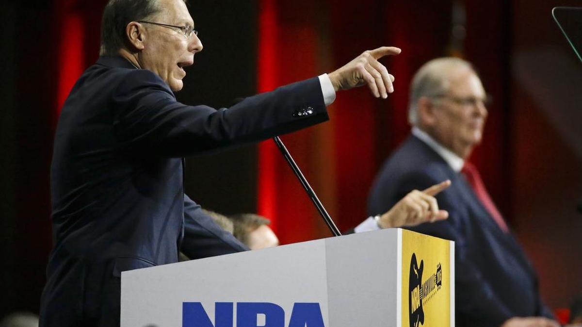 Wayne LaPierre, left, executive vice president of the National Rifle Association, speaks during the annual meeting of members at the NRA convention Saturday, April 11, 2015, in Nashville, Tenn. At right is Jim Porter, NRA president.