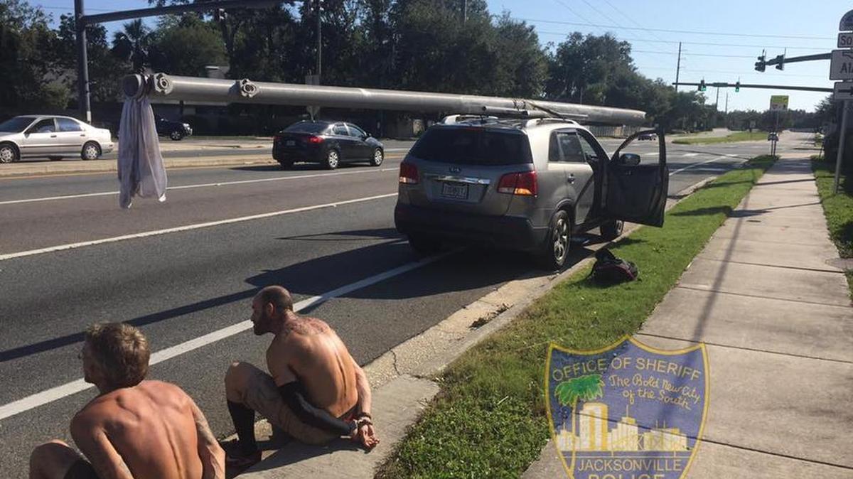 Florida police arrested two men on Wednesday morning for trying to steal a utility pole—which they had strapped to the top of an SUV.