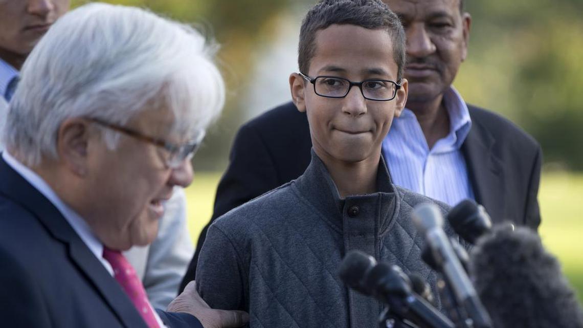 Ahmed Mohamed, second from right, listens as Rep. Mike Honda, D-Calif., left, speaks during a news conference on Capitol Hill in Washington, Tuesday, Oct. 20, 2015. Mohamed is the 14-year-old “clock kid”, freshman, who was arrested in Irving, Texas, for bringing an alarm clock science project to his high school teacher. To the far right is Ahmed's uncle Aldean Mohamed.