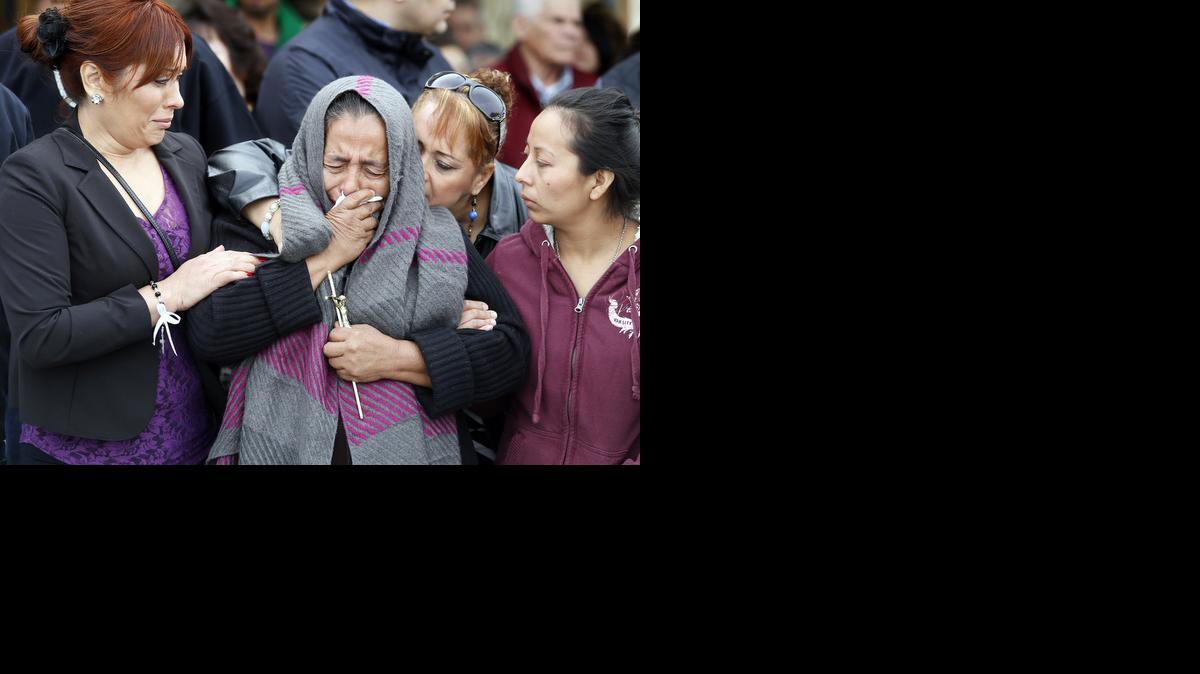 
Agapita Montes-Rivera, second from left, the mother of Antonio Zambano-Montes, is comforted following the funeral for her son Wednesday at St. Patrick’s Catholic Church in Pasco, Wash. Police killed the unarmed man, who spoke little English, after he allegedly threw rocks at officers.
