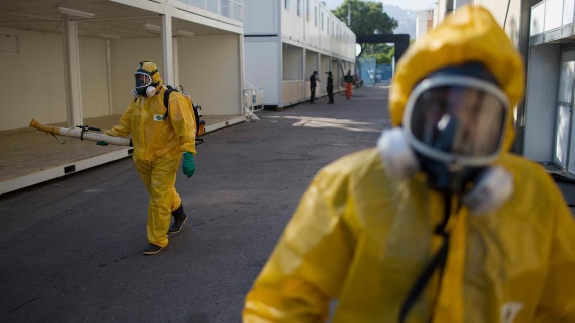 A health worker sprays insecticide to combat the Aedes aegypti mosquitoes that transmits the Zika virus at the Sambadrome in Rio de Janeiro, Brazil, Tuesday. U.S. health officials urged doctors in the United States to test newborns showing signs of the Zika virus.