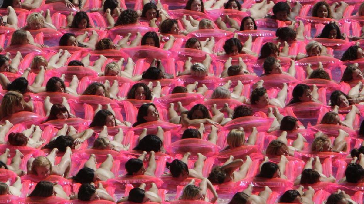 In 2007, a big group of nude women on pink rafts posed in a Miami Beach hotel pool for artist Spencer Tunick.