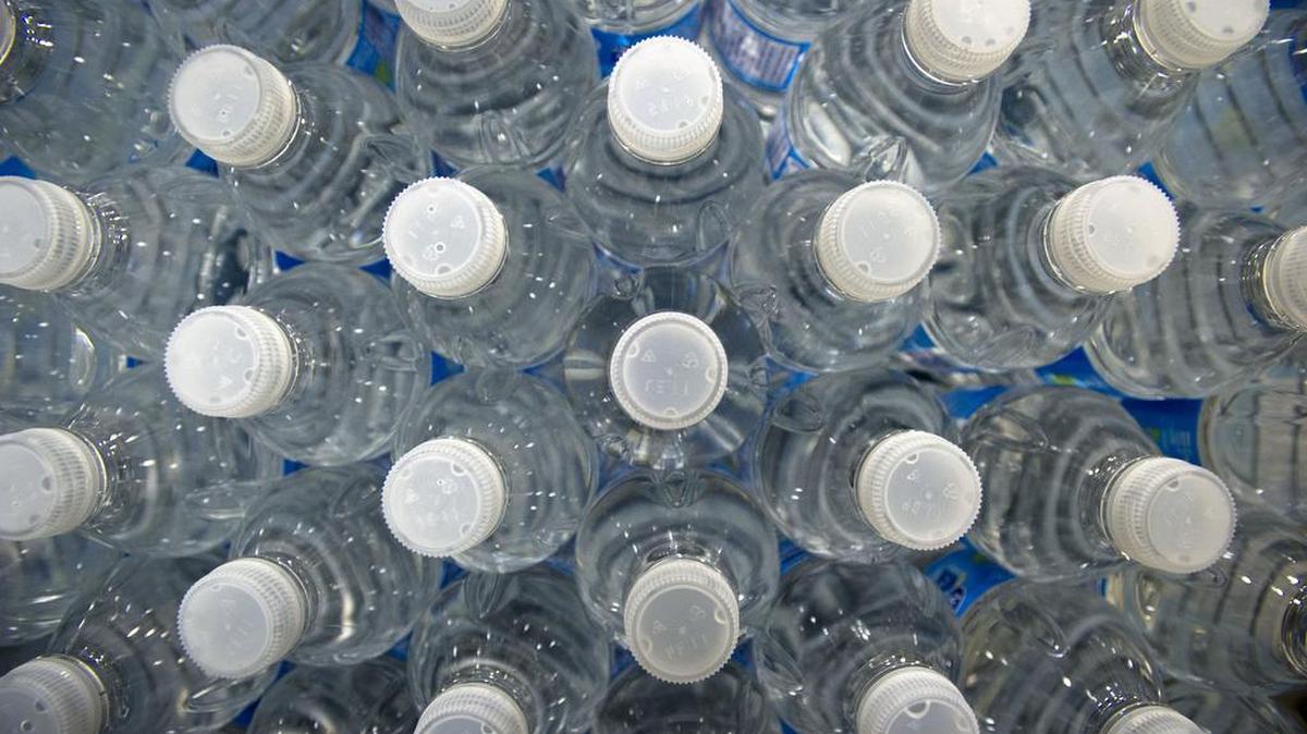 Bottles of water move on the production line at the Nestle Waters Canada plant near Guelph, Ontario, Canada. Nestle, the world's largest food company, owns about 60 water brands.