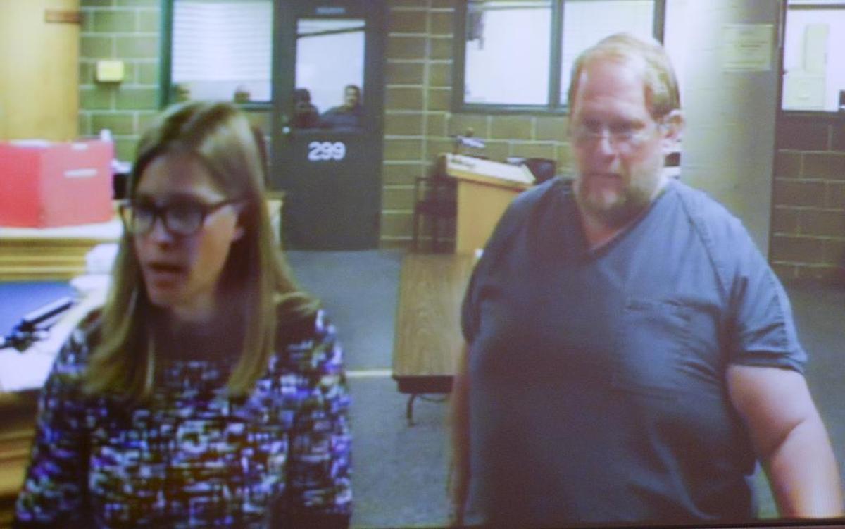 David Frick, right, makes his first appearance in a Whatcom County Jail courtroom with deputy public defender Maialisa Vanyo, on Friday, Aug. 5, 2017. Frick faced charges of voyeurism and possessing child pornography. Frick, a Bellingham city employee, admitted videotaping four female employees in a changing area at the Arne Hanna Aquatic Center, according to the Bellingham Police Department.