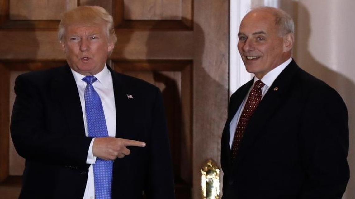 President-elect Donald Trump talks to media as he stands with retired Marine Gen. John Kelly, at the Trump National Golf Club Bedminster clubhouse in Bedminster, N.J.