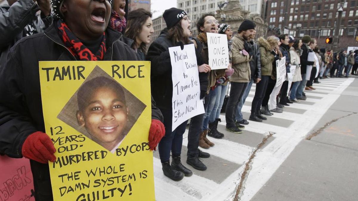 In this Nov. 25, 2014, file photo, demonstrators block Public Square Tuesday, Nov. 25, 2014, in Cleveland, during a protest over the police shooting of 12-year-old Tamir Rice.