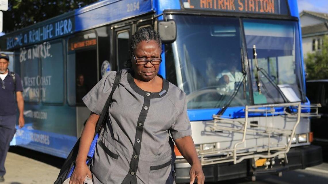 Fontainebleau housekeeper Odelie Paret heads home to catch the second bus as she heads home during her 13.5-mile journey between her job on Miami Beach and her modest two-bedroom apartment which exemplifies the ugly reality for most in today's local tourism workforce. After hearing her story, Drake gave Paret a $10,000 shopping spree at Saks Fifth Avenue.