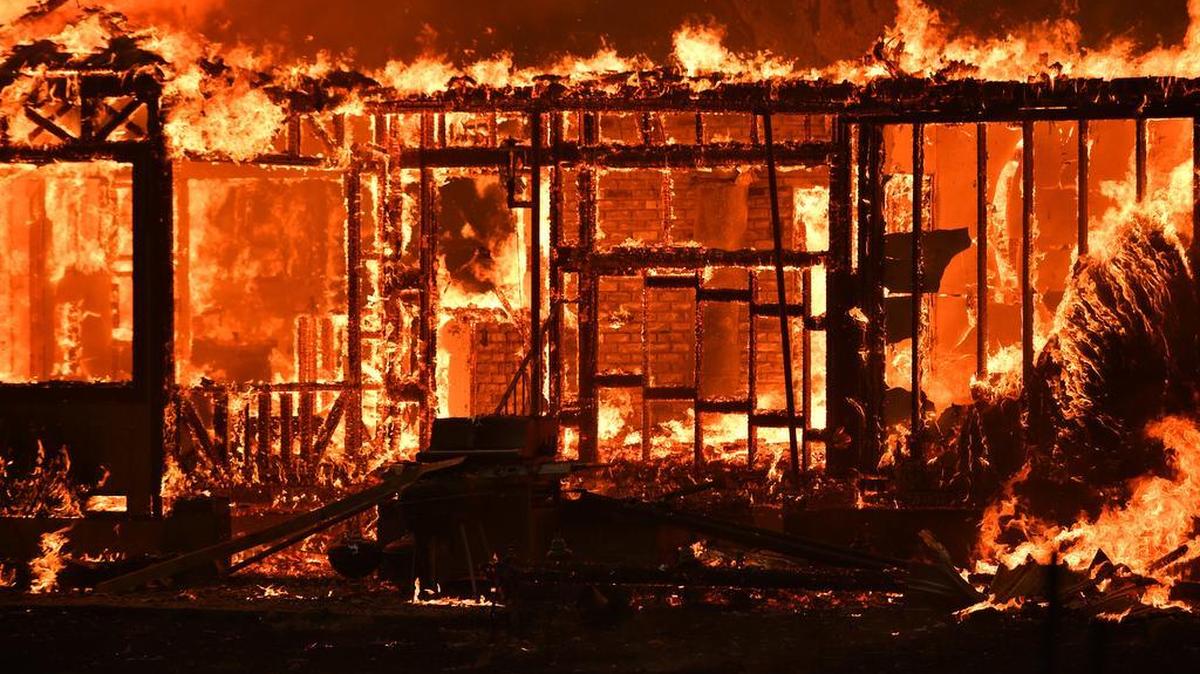 A home burns near the town of Lower Lake, Calif. on Sunday, August 14, 2016.