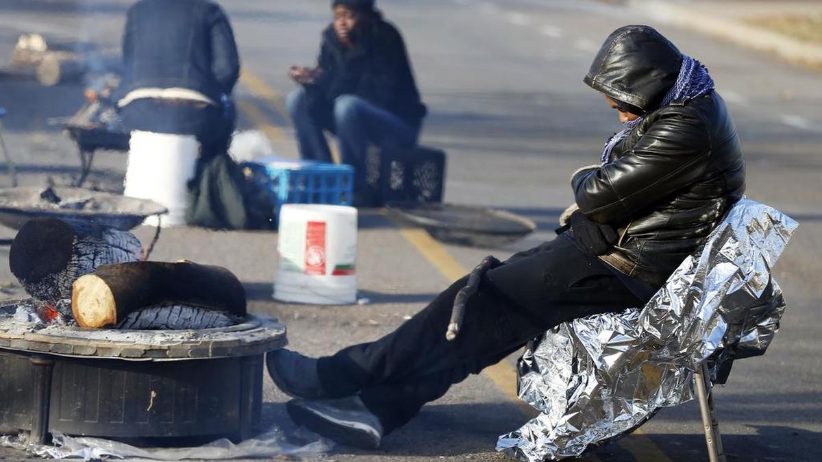 Black Lives Matter demonstrators maintained their encampment, Tuesday, Nov. 24, 2015, outside the Minneapolis Police Department's Fourth Precinct in Minneapolis. The fatal shooting of Jamar Clark, an unarmed black man by a Minneapolis police officer, has pushed racial tensions in the city's small but concentrated minority community to the fore, with the police precinct besieged by the makeshift encampment and many protesters.