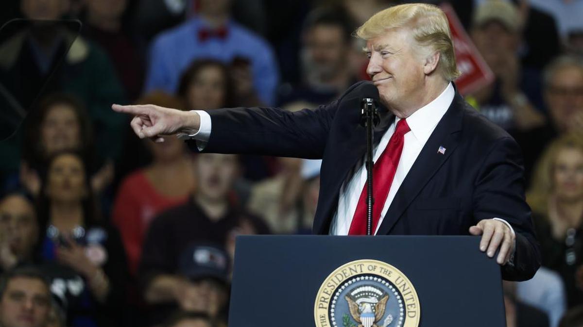 President Donald Trump points as he speaks during a rally at the Kentucky Exposition Center, Monday, March 20, 2017, in Louisville, Ky.
