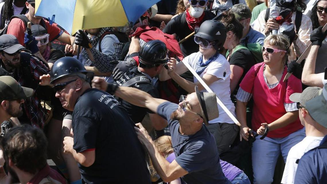 White nationalist demonstrators clash with counter demonstrators in Charlottesville, Va., Saturday, Aug. 12, 2017.