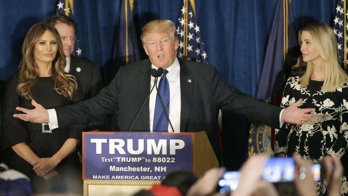 Republican presidential candidate, businessman Donald Trump speaks to supporters during a primary night rally, Tuesday, Feb. 9, 2016, in Manchester, N.H. At his side are his wife Melania Trump, left, and daughter Ivanka Trump, right.