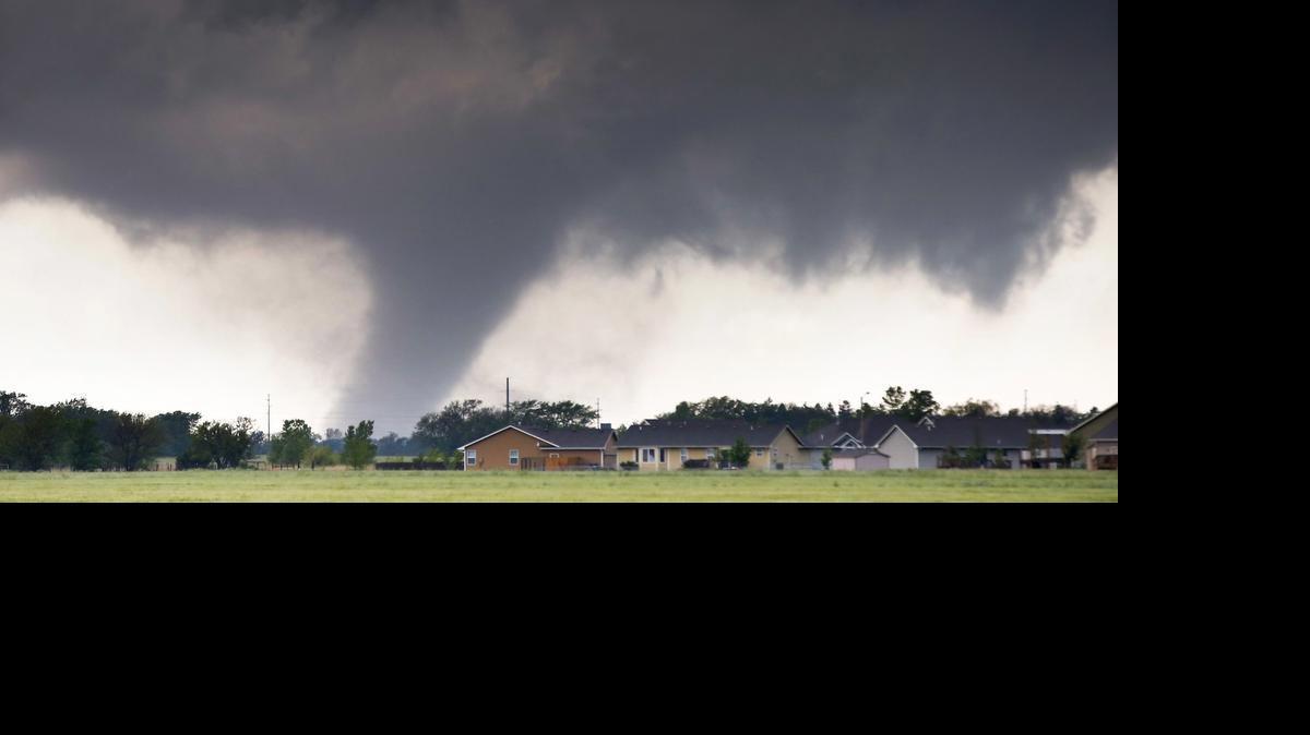 
A tornado passes near Halstead, Kan., Wednesday. A swath of the Great Plains is under a tornado watch Wednesday, including parts of North Texas, Oklahoma, Kansas and Nebraska.
