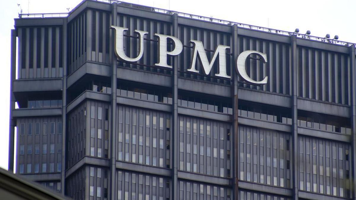 The signs marking the offices for the University of Pittsburgh Medical Center are seen on top of the U.S. Steel tower on Monday, April 3, 2017, in Pittsburgh.