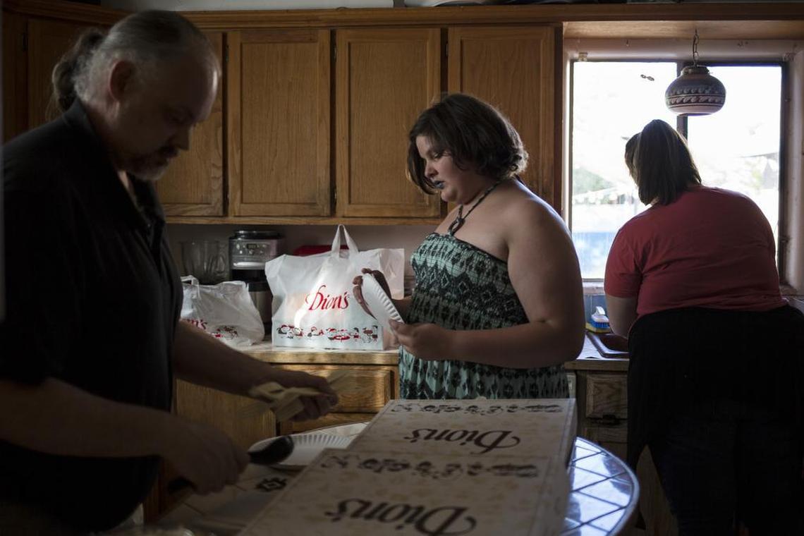 Hazel Compton, 12, who remembers being given a sandwich of white bread with a slice of cheese instead of the hot lunch served to other children at her elementary school, at home with her parents in Albuquerque, N.M., April 18, 2017. Holding children publicly accountable for unpaid school lunch bills – by throwing away their food, providing a less desirable alternative lunch or branding them with markers – is often referred to as “lunch shaming,” and is widespread.