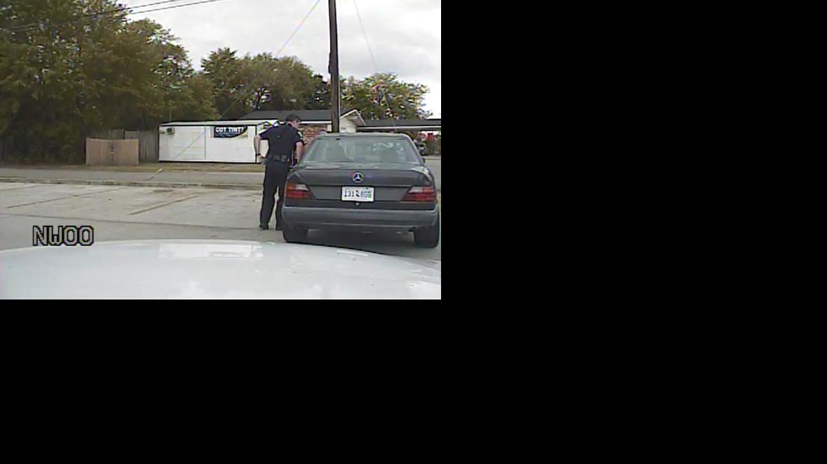 
In this April 4, 2015, frame from dashboard video provided by the North Charleston Police Department, Patrolman Michael Thomas Slager stands by Walter Lamer Scott's car during a traffic stop in North Charleston, S.C.
