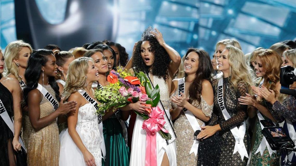 Miss District of Columbia USA Kara McCullough, center, reacts with fellow contestants after she was crowned the new Miss USA during the Miss USA contest Sunday in Las Vegas.