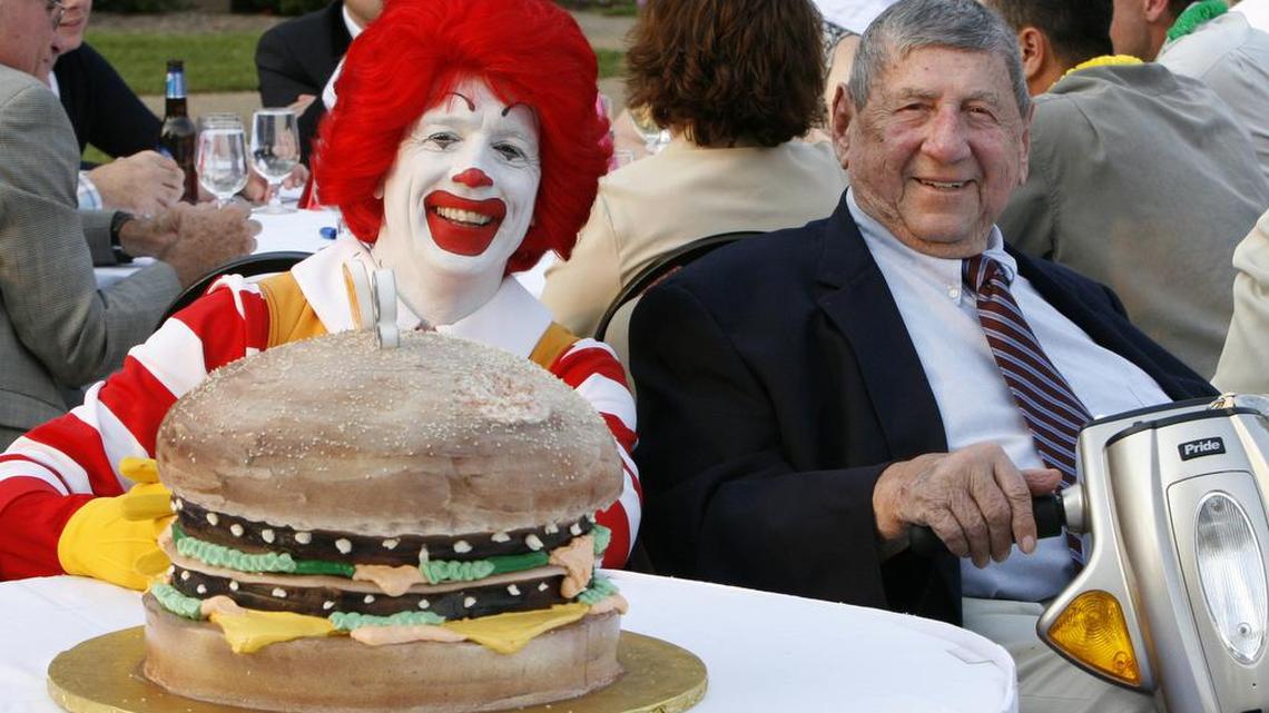 Big Mac creator Jim Delligatti, right, poses with a Big Mac birthday cake and Ronald McDonald at his 90th birthday party in Canonsburg, Pa., in 2008. Delligatti died Monday.