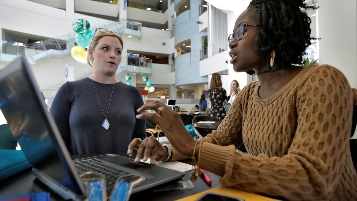 In this Tuesday, Jan. 24, 2017, file photo, Xonjenese Jacobs, right, helps Kristen Niemi sign up for the Affordable Care Act during a healthcare expo at the University of South Florida, in Tampa, Fla. The Affordable Care Act’s fate is unclear. President Donald Trump has vowed to repeal it, but lawmakers have yet to reach an agreement on a replacement, leaving millions of people wondering how to deal with the ACA's uncertain future.