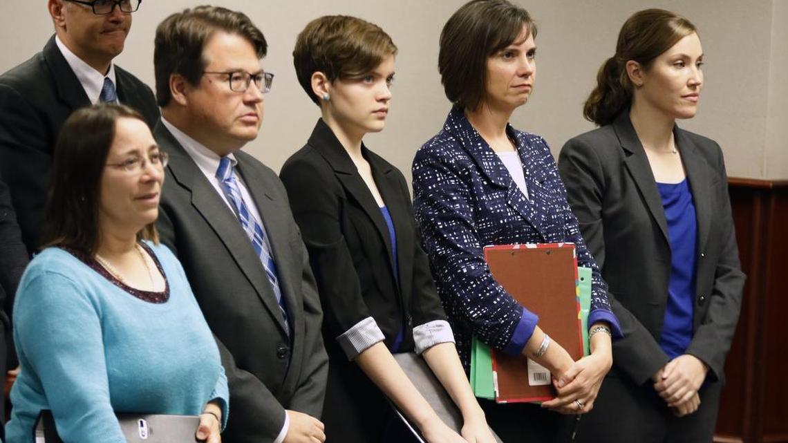 From left, Mark Turner, (background) father of Hallie Turner, attorneys Gayle Tuch and Ryke Longest, 13 year old plaintiff Hallie Turner and Turner's mom, Kelly Turner and attorney Shannon Arata stand before Wake Judge Michael Morgan in Wake County Civil Courtroom 5C November 13, 2015 on a motion to force the state of North Carolina to reduce greenhouse gas emissions. Hallie Turner, 13, is an 8th grader at Raleigh's Ligon Middle School.
