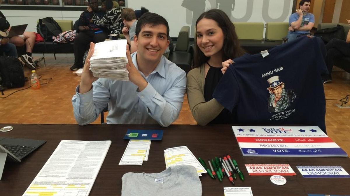 Malek Khawam, left, and Samia Shaheen participate in an Arab American Institute voter registration drive at Cleveland State University on Oct. 10, 2016.
