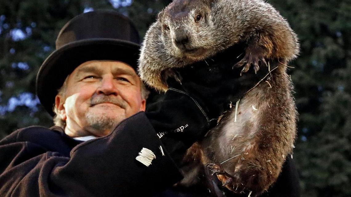 Groundhog Club handler John Griffiths holds Punxsutawney Phil, the weather prognosticating groundhog, during the 131st celebration of Groundhog Day on Gobbler’s Knob in Punxsutawney, Pa. on Thursday. Phil’s handlers said that the groundhog has forecast six more weeks of winter weather.