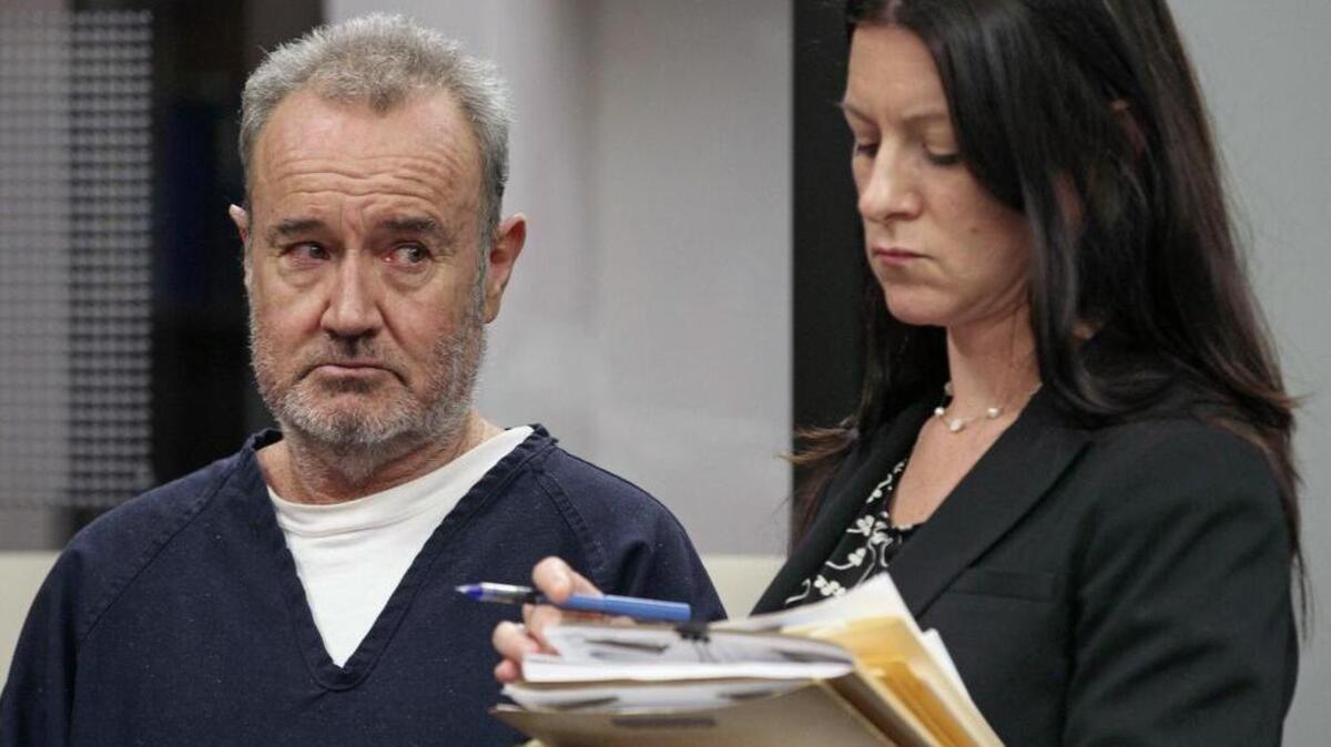 In this May 8, 2013, file photo, Peter Robbins, the original voice of Charlie Brown in “Peanuts” television specials, appears in court with attorney Kristin Scogin in San Diego. The former child actor has pleaded guilty Tuesday, Nov. 10, 2015, to making criminal threats.