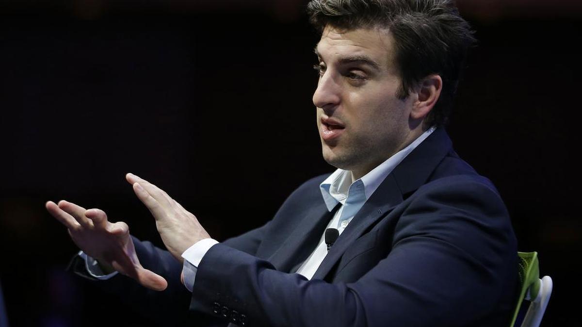 Airbnb co-founder and CEO Brian Chesky gestures while speaking at the Fortune Global Forum Wednesday, Nov. 4, 2015, in San Francisco. Airbnb has comes under fire for not doing enough to prevent discrimination by its users. (AP Photo/Eric Risberg)