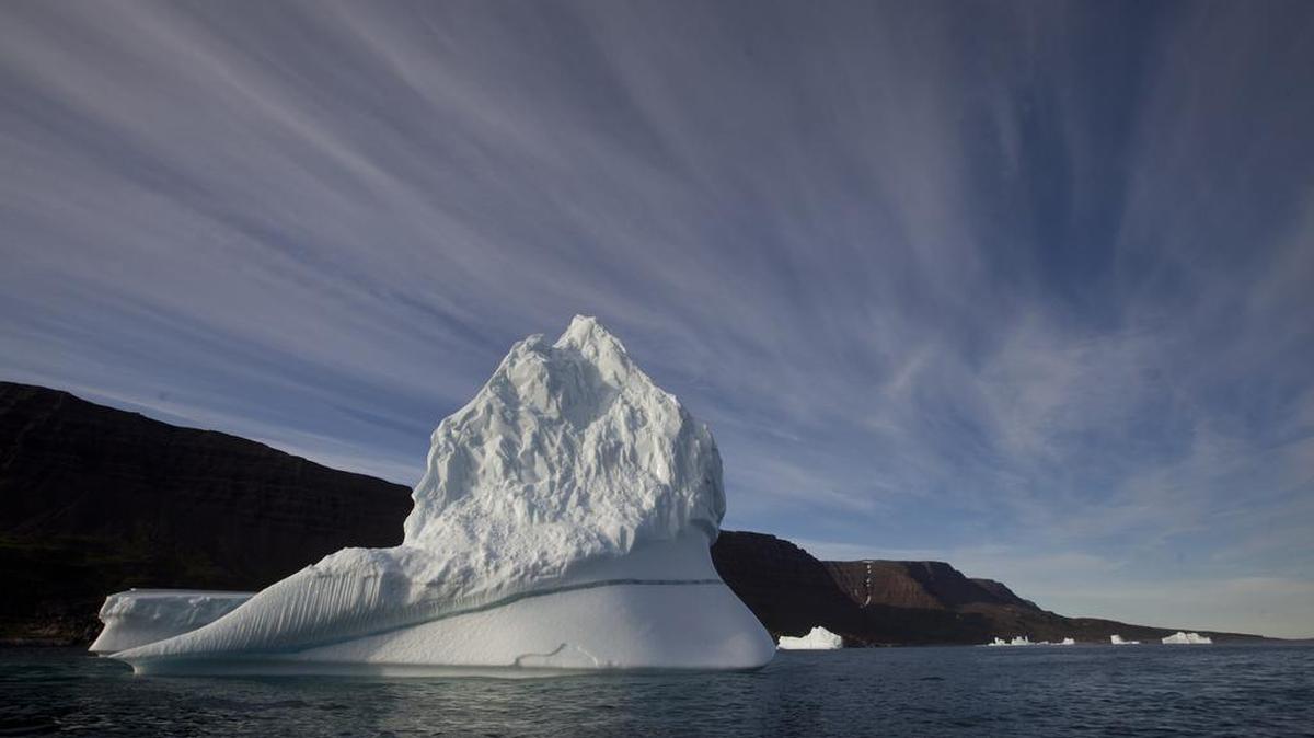 An iceberg floats in the sea near Qeqertarsuaq, Disko Island, Greenland, on July 21, 2011. Global warming is shifting the way the Earth wobbles on its polar axis, a new NASA study finds.