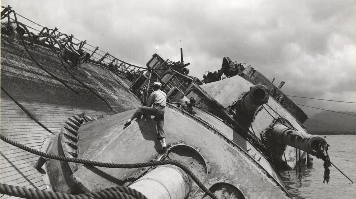 The USS Oklahoma was sunk by several bombs and torpedoes during the Japanese attack on Pearl Harbor, hawaii. A total of 429 crew died when the ship capsized. The Oklahoma was righted and salvaged in 1943 and the remains of many crew members were recovered. However, unlike most of the other battleships that were recovered following Pearl Harbor, the Oklahoma was too damaged to return to duty. She was eventually stripped of her remaining armaments and superstructure before being sold for scrap in 1946.
