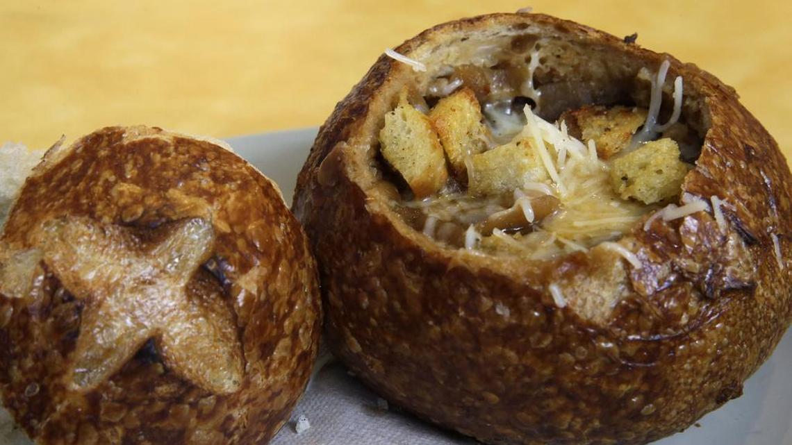 
This June 9, 2015, file photo, shows a Bistro French Onion Soup Bread Bowl at a Panera bread restaurant in New York. The city Board of Health voted unanimously Wednesday, Sept. 9 to require chain eateries to put salt-shaker symbols on menus to denote dishes with more than the recommended daily limit of 2,300 milligrams of sodium. A Bistro French Onion Soup Bread Bowl contains more sodium than the recommended daily limit, which is equal to about 1 teaspoon of salt. 
