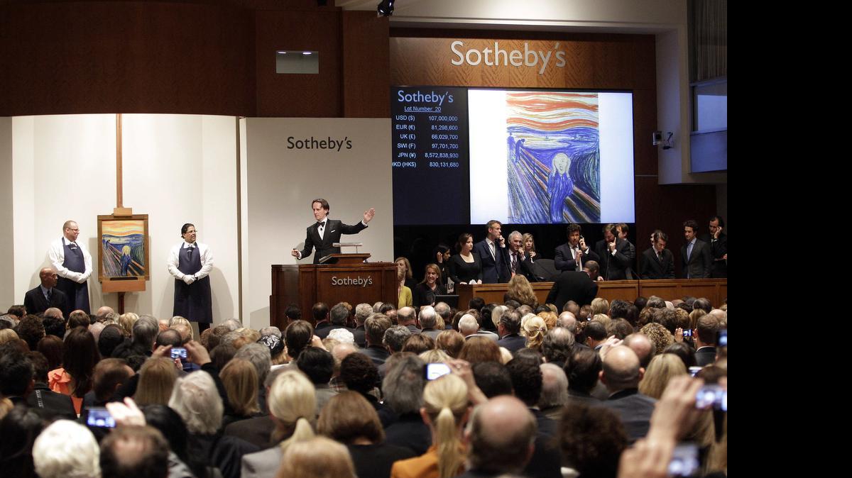 
Edvard Munch's "The Scream," left, is auctioned at Sotheby's in New York, on May 2, 2012. The image, one of four versions created by the Norwegian expressionist painter, sold for $119.9 million. Only a handful of other works have sold at auction for $100 million or more, but two more artworks, Pablo Picasso's "Women of Algiers (Version O)," and Alberto Giacometti's life-size sculpture “Pointing Man,” are poised to break records soon during Christie’s upcoming spring sale Monday May 11, 2015. 
