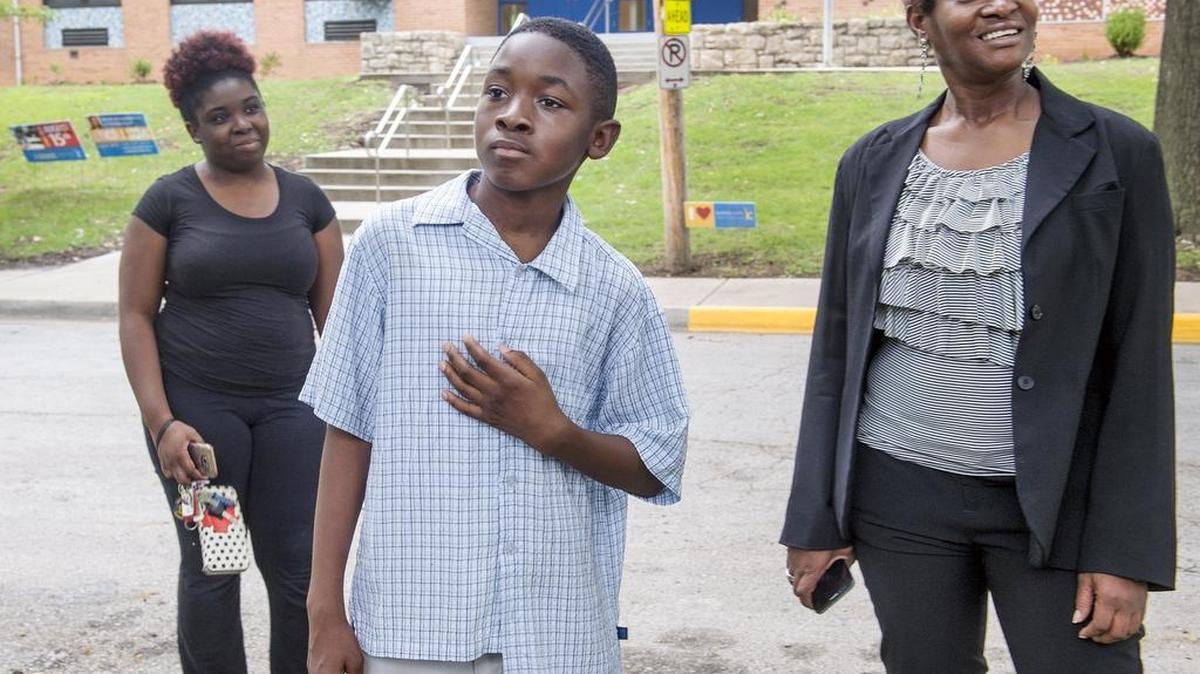 Kalyb Wiley Primm, 10, center, his sister Kira Wiley, left, and mother Tomesha Primm spoke to the media on Thursday, Sept. 8, 2016, in front of George Mechler Elementary School in Kansas City. The family, with the help of the American Civil Liberties Union, has sued the Kansas City School District in federal court over an 2014 incident in which a school resource officer handcuffed 7-year-old Kalyb Wiley Primm while waiting for the child's parents to arrive following a disturbance in a classroom. The family claims the restraint was unnecessary as Kalyb posed to threat to anyone and violated state and federal law.