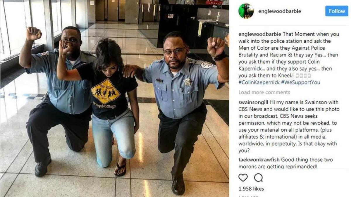 Two Chicago police officers were photographed kneeling with community activist Aleta Clark to protest police brutality and racism. Their department says they will be reprimanded for making a political display in uniform.