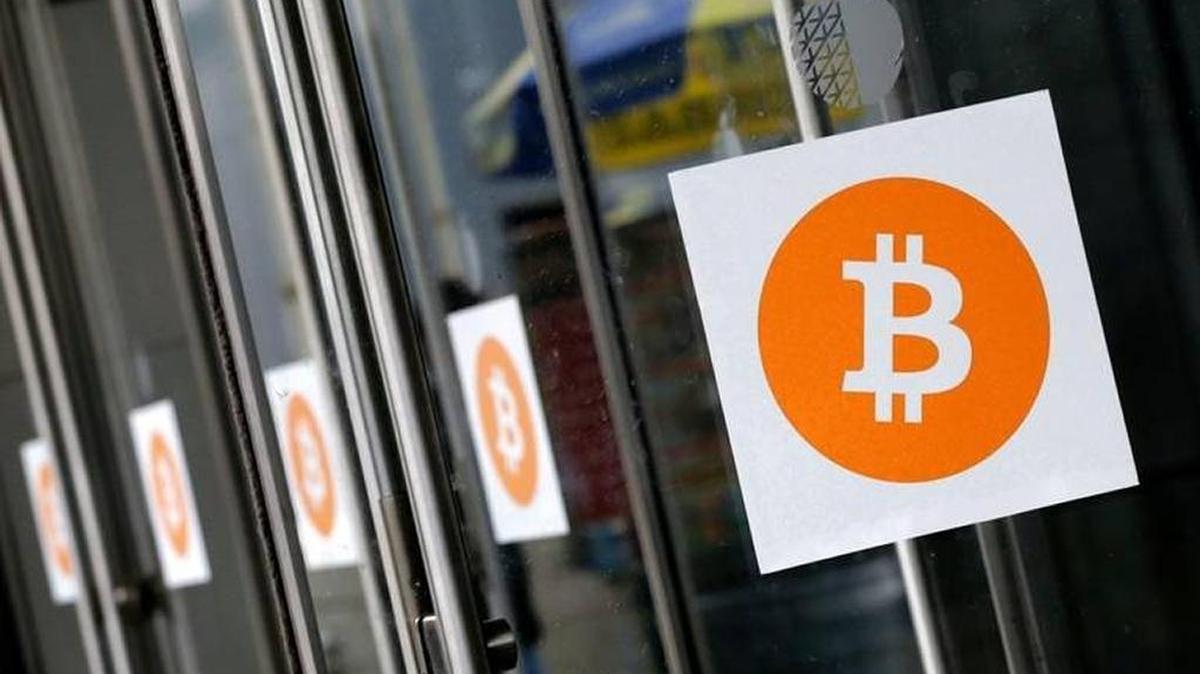 Bitcoins are gaining respectability as a digital currency, leading to massive price speculation. Here logos are displayed at the Inside Bitcoins conference and trade show in New York.