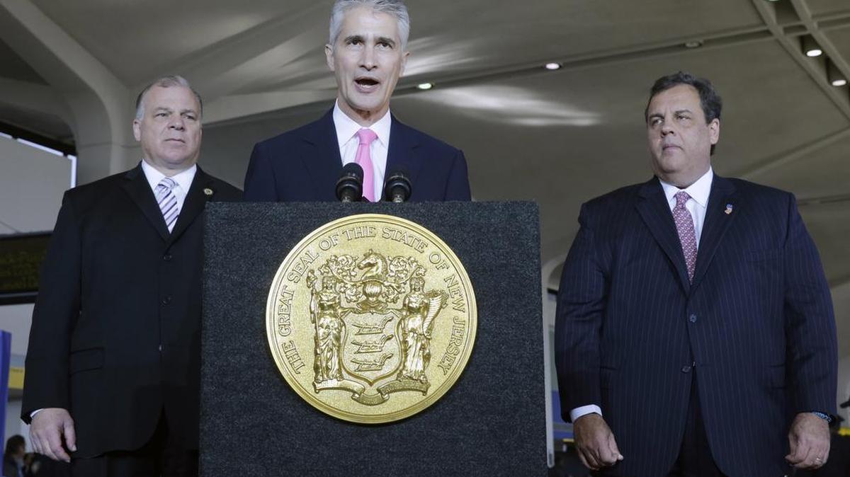 
New Jersey Senate President Steve Sweeney, left, and Gov. Chris Christie, right, listen to United Airlines CEO Jeff Smisek at Newark Liberty International Airport, in Newark, N.J., in 2013.
