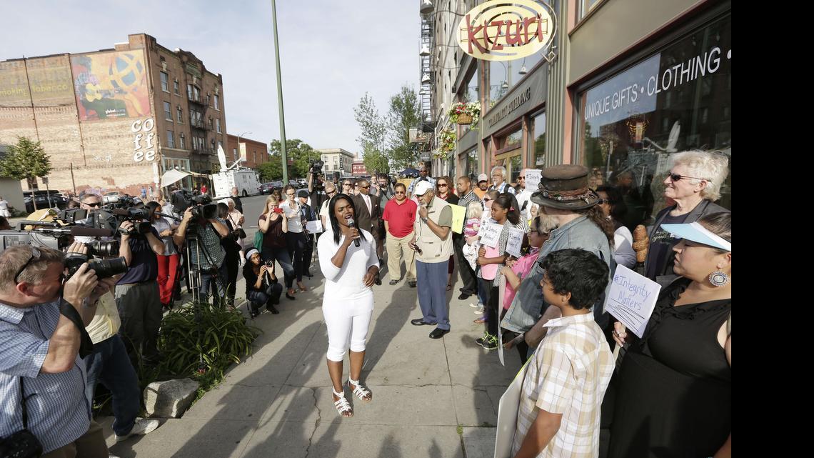 
Kitara Johnson, center, speaks during a demonstration Monday in Spokane, Wash. Rachel Dolezal resigned as president of the NAACP's Spokane chapter Monday just days after her parents said she is a white woman posing as black.
