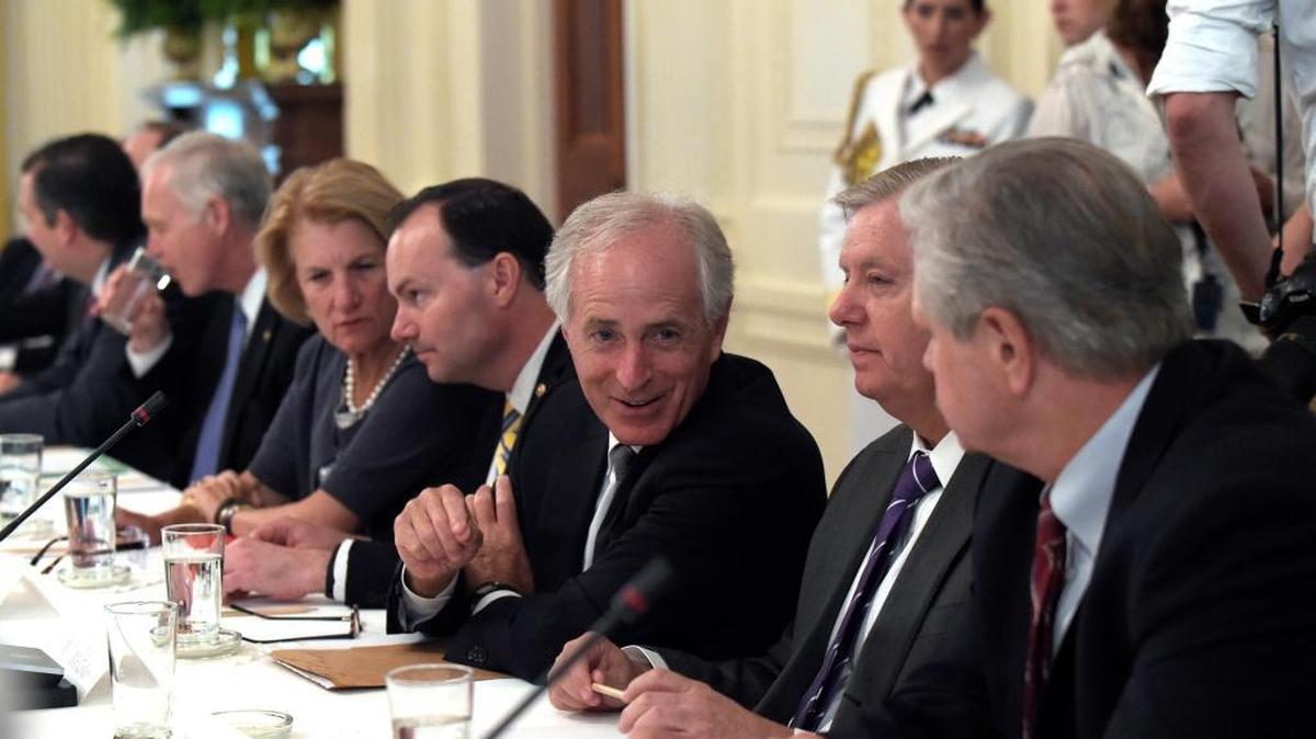 Sen. Bob Corker, R-Tenn., third from right, talks with Sen. Lindsey Graham, R-S.C., second from right, and Sen. John Hoeven, R-N.D., right as they wait for President Donald Trump to join a meeting of Republican senators on health care in the East Room of the White House in Washington, Tuesday, June 27, 2017. Others a the table are, from left, Sen. Ted Cruz, R-Texas, Sen Ron Johnson, R-Wis., Sen. Shelley Moore Capito, R-W.Va., and Sen. Michael S. Lee, R-Utah.