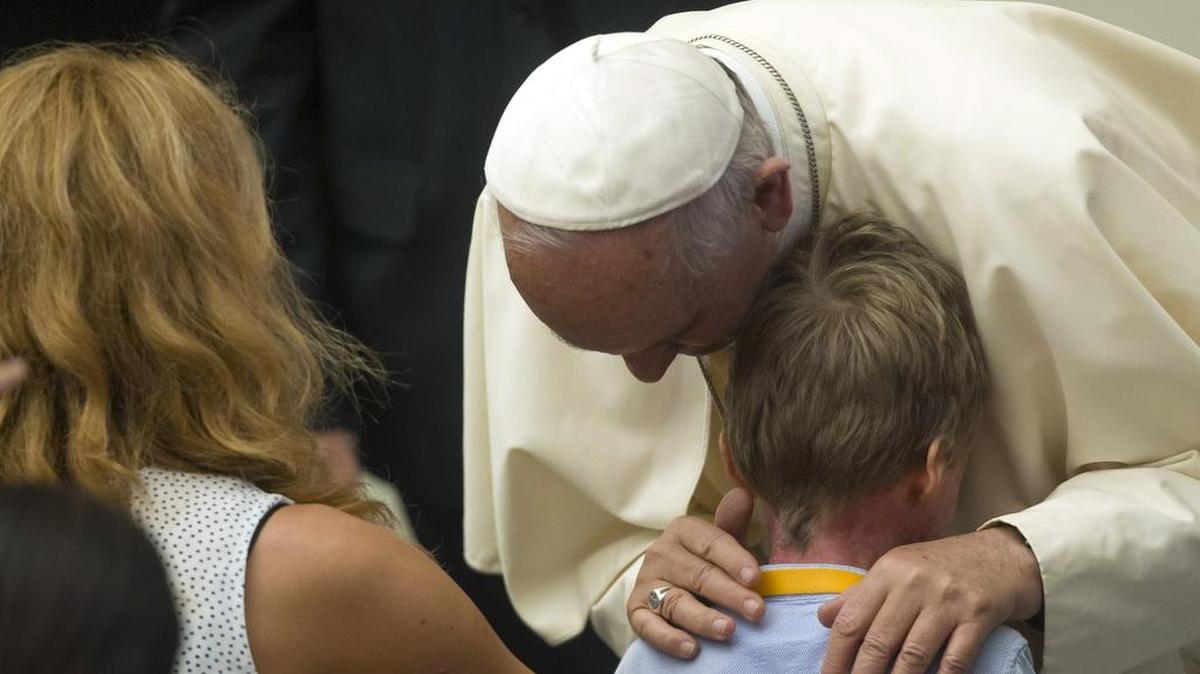 
Pope Francis greets a child at the end of audience to Parish groups promoting evangelization, in the Paul VI hall at the Vatican, Saturday, Sept. 5, 2015. He is set to canonized 18th-century Franciscan missionary Junipero Serra on Sept. 23.
