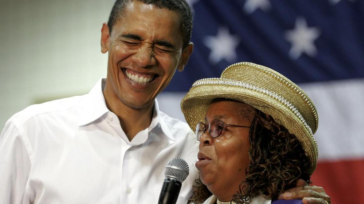 Then-presidential hopeful Sen. Barack Obama, D-Ill., shares a laugh with Greenwood County, S.C., councilwoman Edith Childs in Aiken, S.C., in October 2007. Childs and Earl Smith, of Austin, Texas, are two people who inspired Obama during his first presidential campaign who will attend his final State of the Union address.