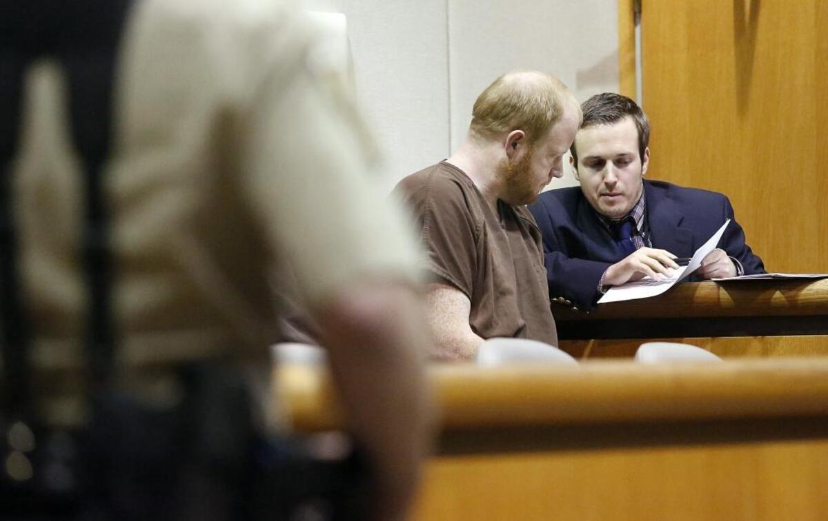 Roy David Farber, left, talks with defense attorney Michael Vander Sys in Benton County Superior Court in Kennewick.