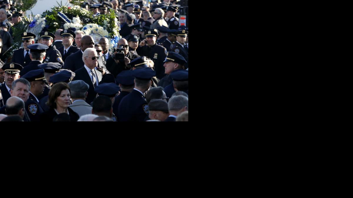 
U.S. Vice President Joe Biden, center, arrives for funeral services for New York City police officer Rafael Ramos at Christ Tabernacle Church, in the Glendale section of Queens, Saturday, Dec. 27, 2014, in New York. 
