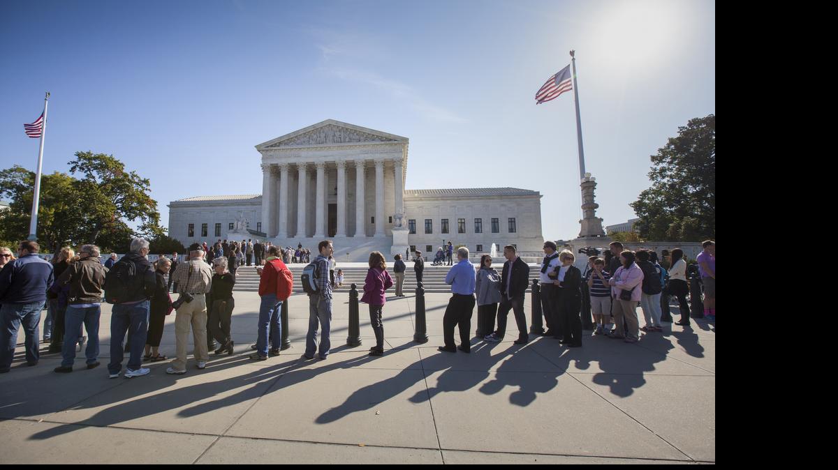 
People wait to enter the Supreme Court in Washington on Oct. 16. Only two years ago, the Supreme Court struck down part of the federal anti-gay marriage law that denied a range of government benefits to legally married same-sex couples. The decision did not address the validity of state marriage bans, but courts across the country, with few exceptions, said its logic compelled them to invalidate state laws that prohibited gay and lesbian couples from marrying.
