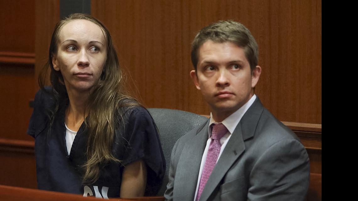
Heather Hironimus, left, sits with her attorney Thomas Hunker as she appears before Palm Beach County Circuit Judge Jeffrey Gillen, Friday, May 22, 2015, in Delray Beach, Fla. 
