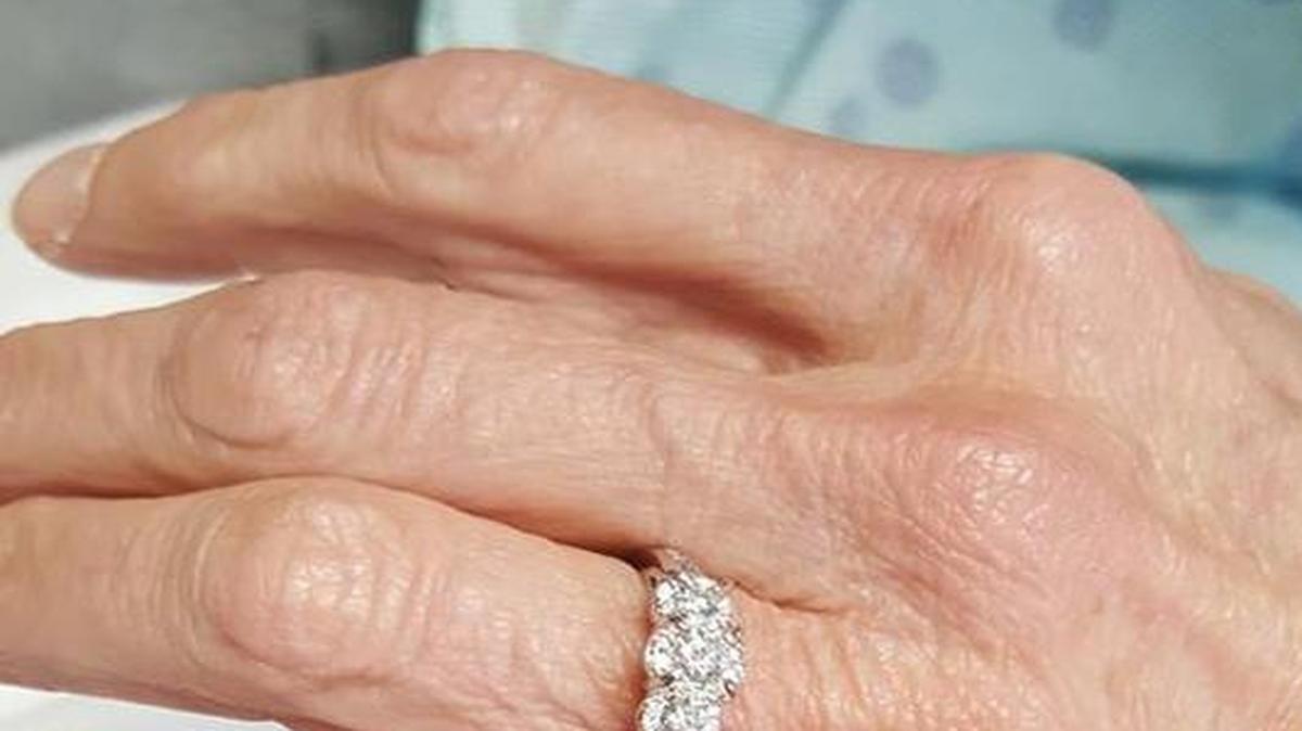 Denise Massey, one of eight people shot in the Vista early September 16, shows off her engagement ring.
