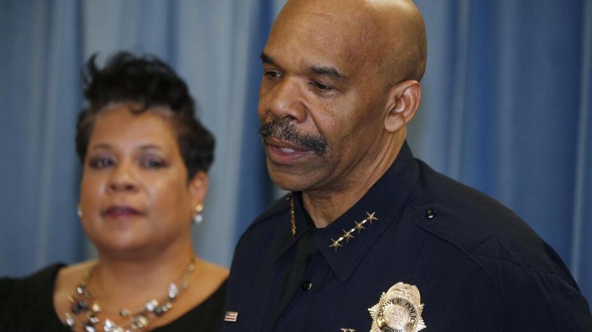 Denver Police Chief Robert White, front, talks about a shooting and stabbing incident at a motorcycle expo during a news conference Saturday, Jan. 30, 2016, in Denver, while Stephanie O’Malley, manager of safety, listens.
