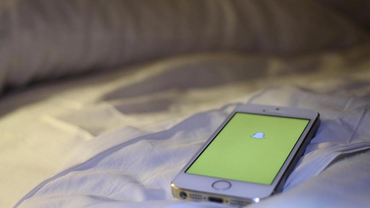 A 14-year-old girl from Tennessee said her father choked and hit her after he found out she had been sending nude photographs on the social media app Snapchat.